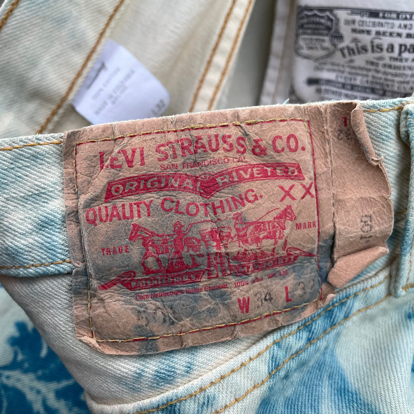 Custom Levi’s Flora Pants – Faded Botanical Art in Soft Red | Vintage Denim 1 of 1