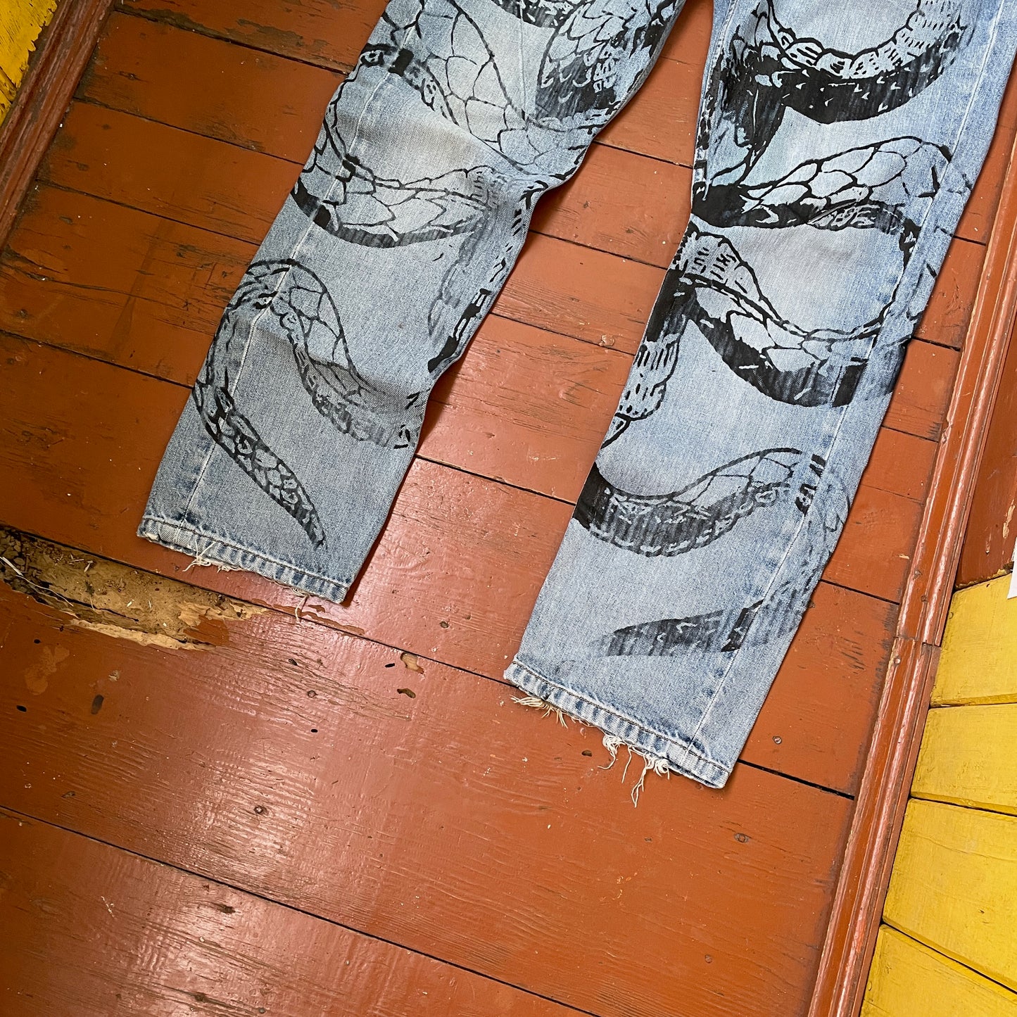 Custom Carhartt Snake Jeans โ Handprinted Black Snake Art on Faded Light Wash Denim | 1 of 1 Reworked Pants