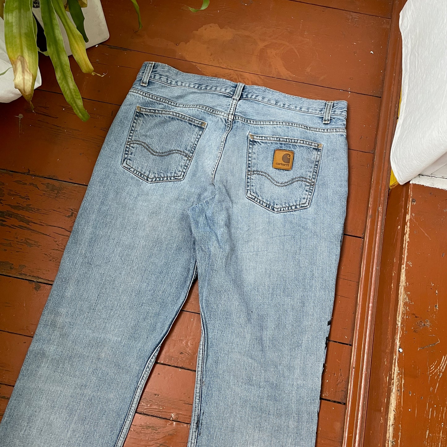Custom Carhartt Snake Jeans โ Handprinted Black Snake Art on Faded Light Wash Denim | 1 of 1 Reworked Pants