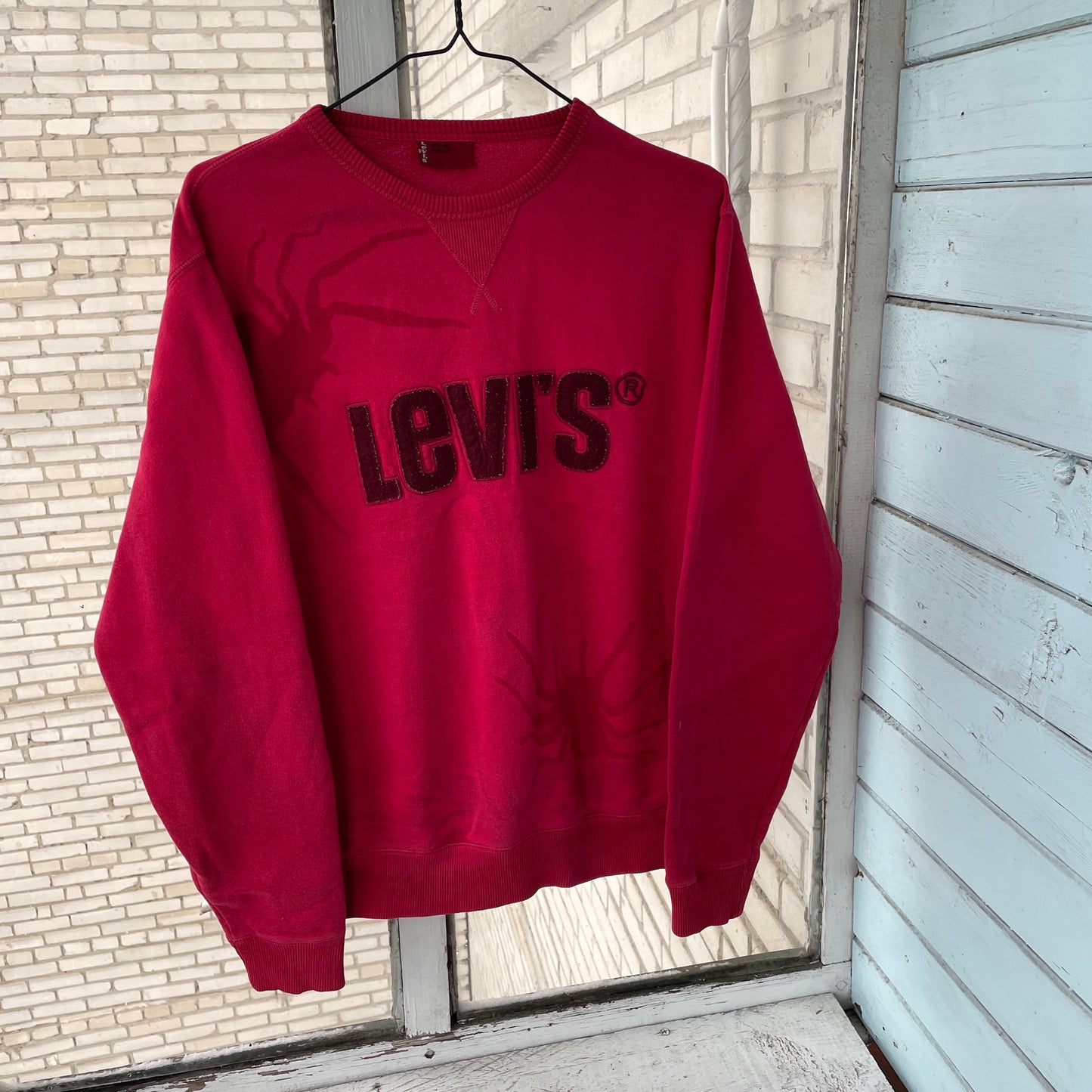 Levi’s Faded Spider Sweatshirt – Vintage Red Levi’s Crewneck with Subtle Spider Fade | 1 of 1