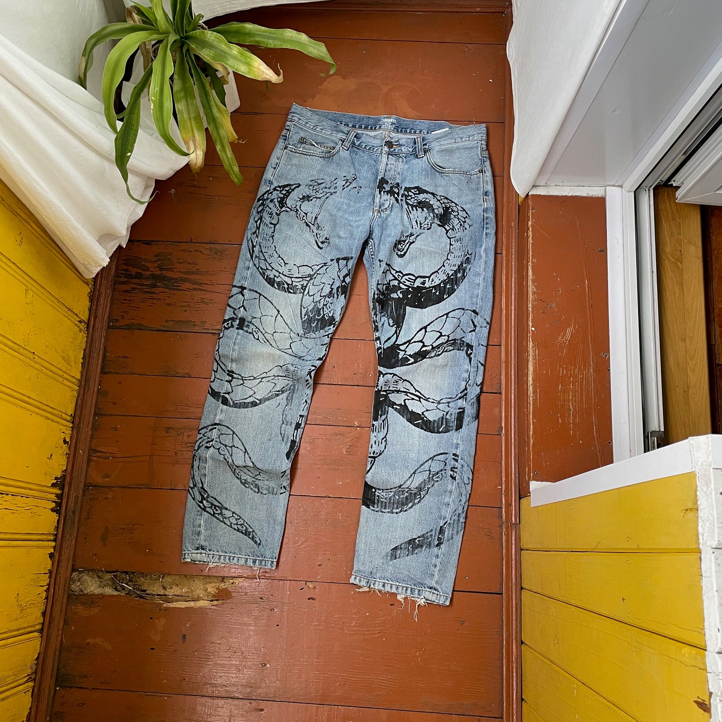 Custom Carhartt Snake Jeans – Handprinted Black Snake Art on Faded Light Wash Denim | 1 of 1 Reworked Pants