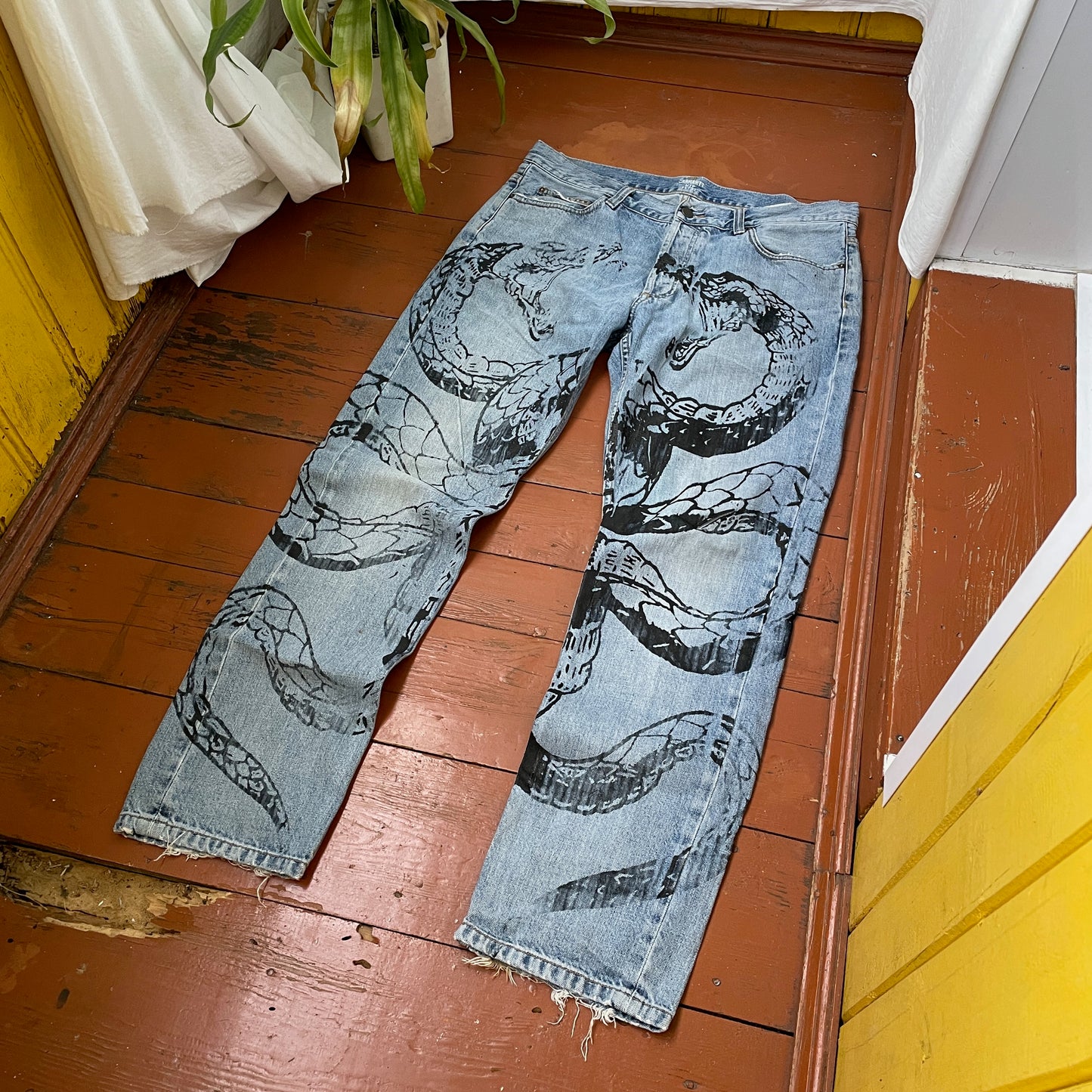 Custom Carhartt Snake Jeans – Handprinted Black Snake Art on Faded Light Wash Denim | 1 of 1 Reworked Pants