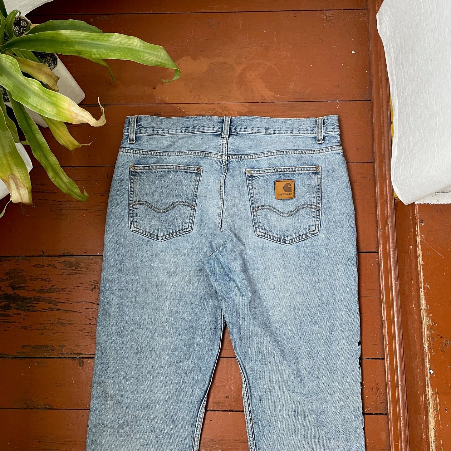 Custom Carhartt Snake Jeans – Handprinted Black Snake Art on Faded Light Wash Denim | 1 of 1 Reworked Pants